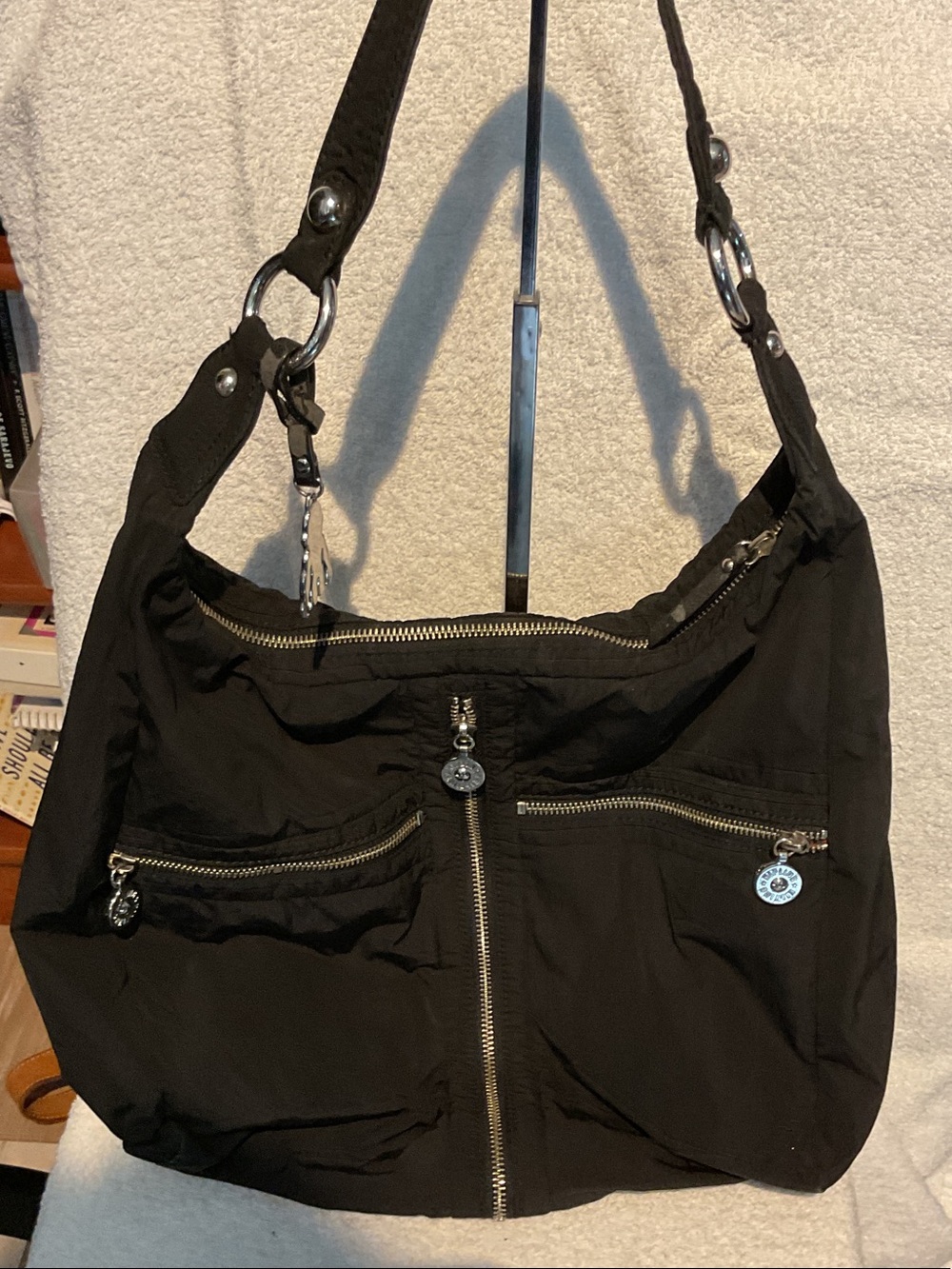 G029. Kipling Black Shoulder Bag with Front Zip Pockets